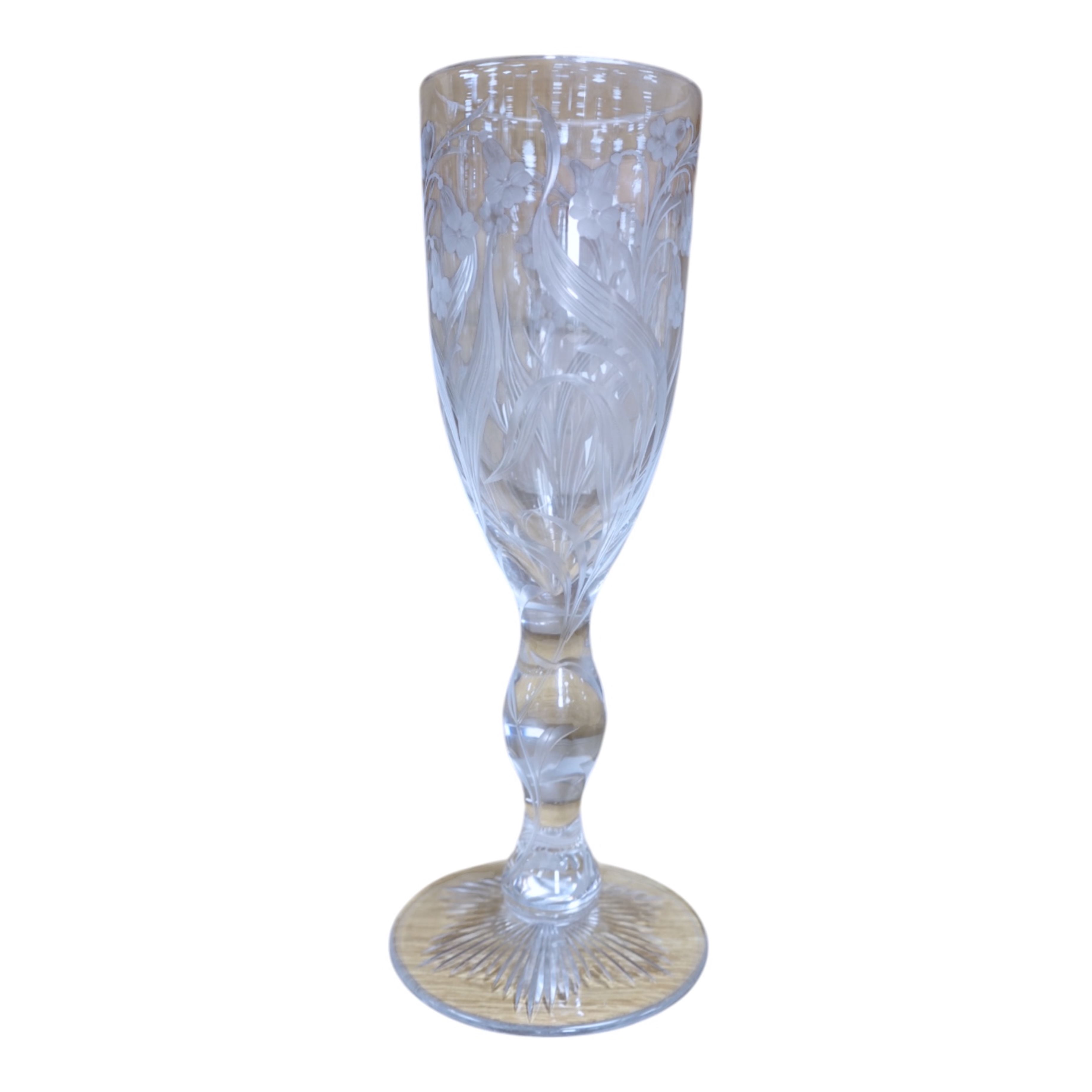 A large ‘floral’ engraved glass flute, 29.5cm. Condition - chip to upper rim